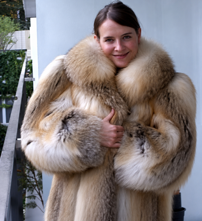 Cozy in a plush fur coat.png